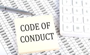 KODEKS POSTĘPOWANIA wiadomość koncepcja biznesowa na naklejce na tle wykresu