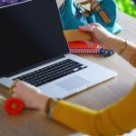 Young woman on a coffee break or enjoying the coffeebreak Using laptop computer