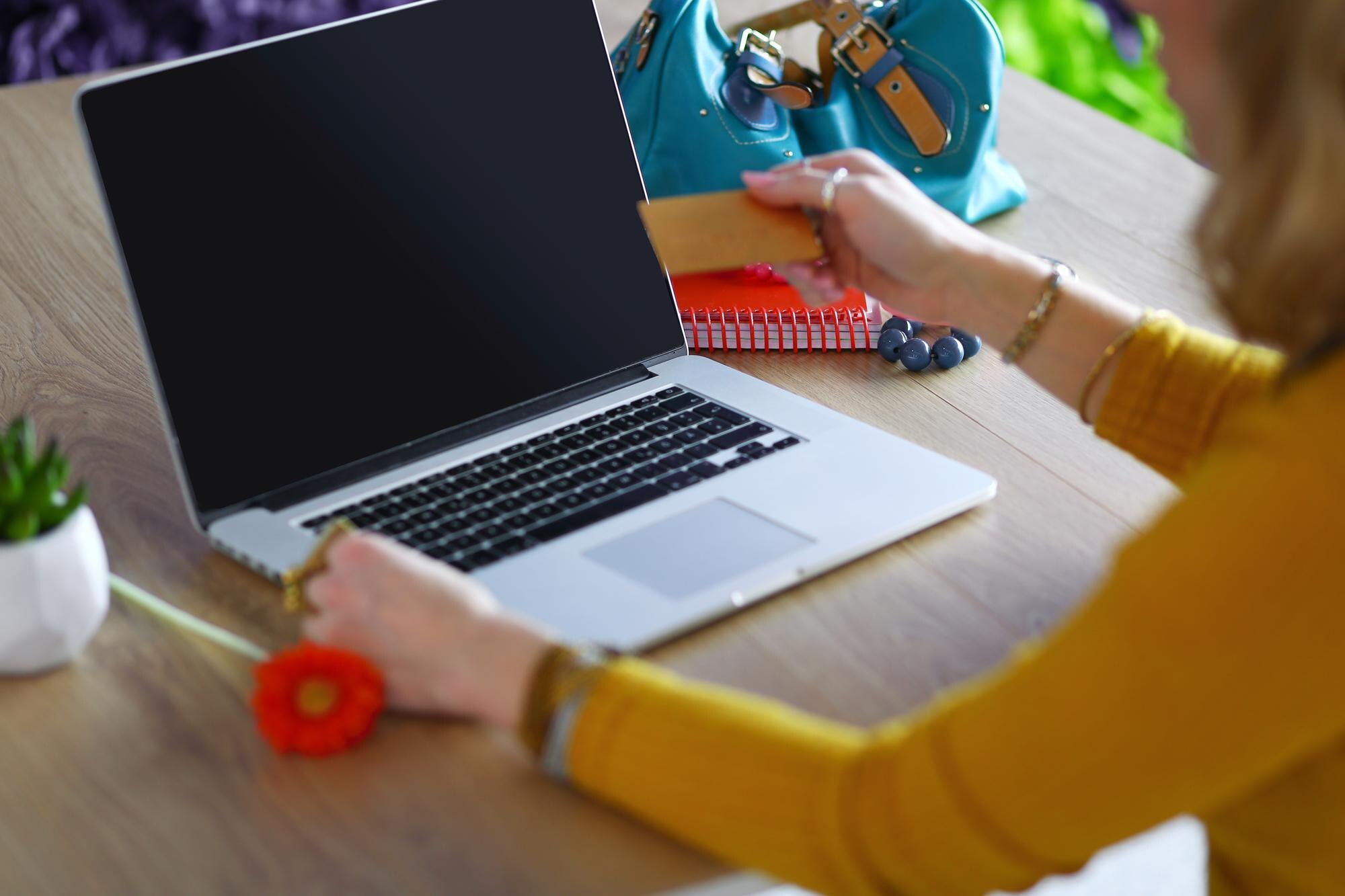 Young woman on a coffee break or enjoying the coffeebreak Using laptop computer