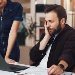 Man laptop and stress for logistics boxes and mistake with order for lost stock and woman in warehouse People computer and supply chain management with distribution error at shipping storage