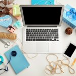 Comfortable bloggers workplace with modern laptop on table